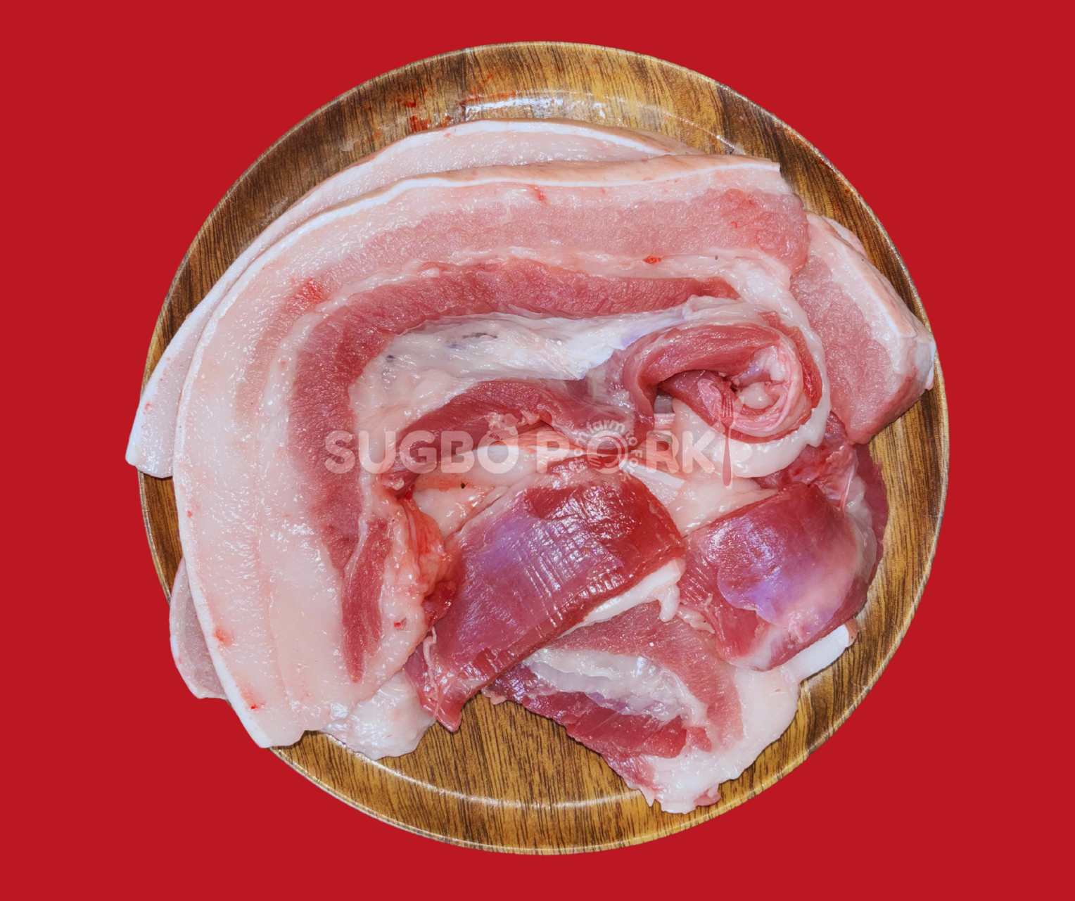 Professional product photography showing fresh, marbled pork belly cuts arranged on wooden circular board with Sugbo Pork watermark against vibrant red background