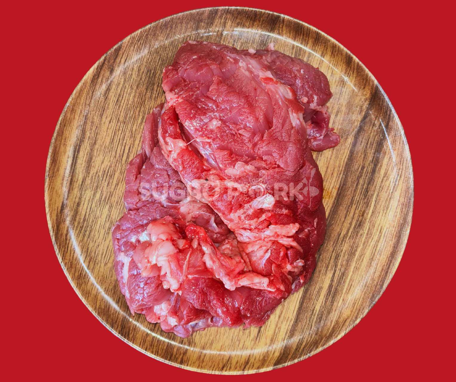 Professional product photography showing fresh pork loin slices arranged on wooden circular cutting board with visible quality marbling and Sugbo Pork watermark against vibrant red background